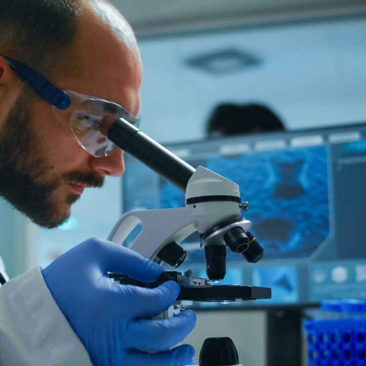 lab technician examining samples liquid using microscope equipped laboratory scaled.jpg